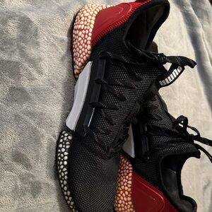 Puma men’s Hybrid Rocket Runner black and high-risk red